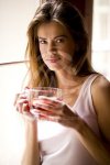 young-woman-holding-cup-of-tea-2.jpg