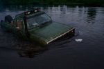My Ramcharger chasing a bag of chips in the lake.jpg