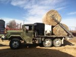 first time to put 2 big round bales on at house.jpg