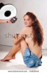 photostock-photo-smiling-woman-photo-model-in-photo-studio-hand-holding-a-light-meter-flash-mete.jpg