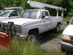 M1008 with plow and bucket truck attachment.jpg