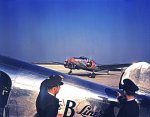 Braniff_Airline_Pilots_Watching_a_Lockheed_12A_Electra_Junior.jpg