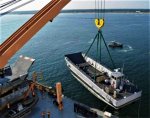 LCM-8 lifted with kevlar slings.jpg